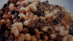 Recepta de cuina de Fesols amb bolets i botifarra de perol